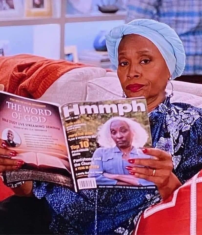 Photo of Jennifer Lewis reading a magazine called Hmmph