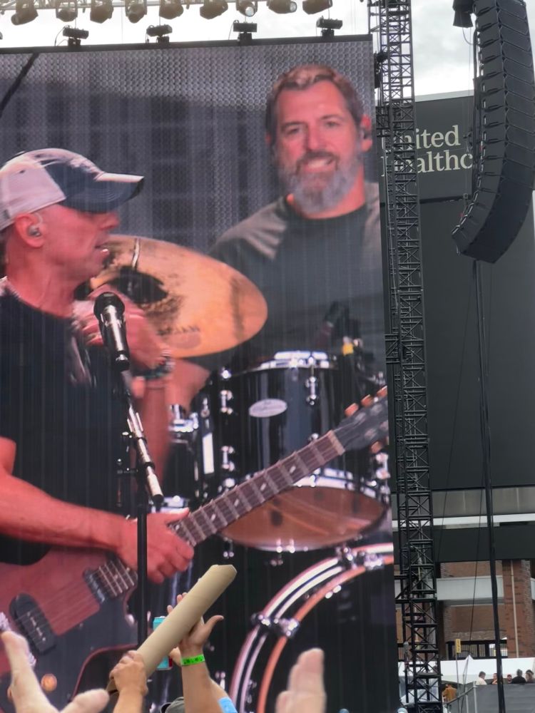 Picture of Kenny chesney and his drummer at farm aid