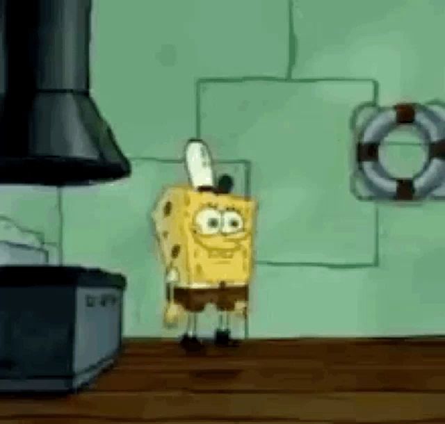 spongebob squarepants is standing on a wooden table in a kitchen holding a knife .