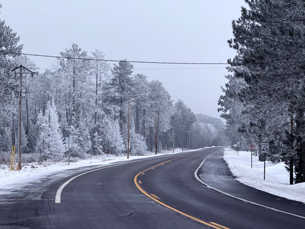 A road surrounded by frost-covered trees in northern Minnesota 