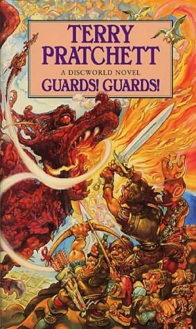 The British paperback cover of Guards! Guards! by Terry Pratchett. It shows a bunch of people of various sizes and shapes, dressed in armor and using swords/arrows against a dragon that's breathing fire at them. It's kind of grotesque in art style but I love it. 