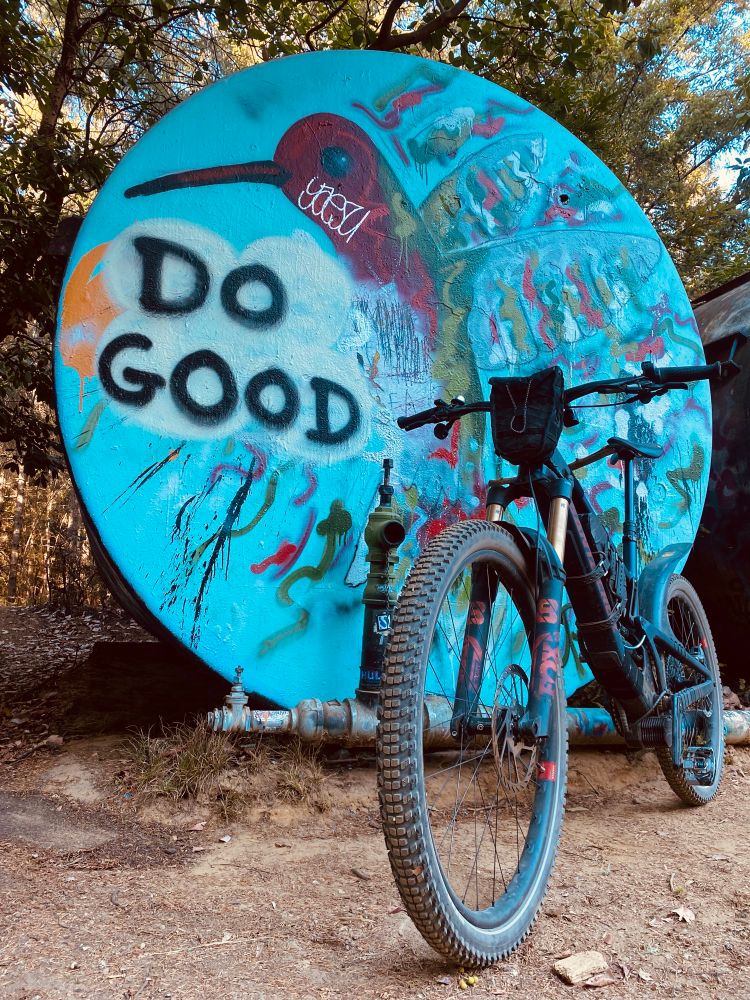 Spray paint art and a mountain bike infront 