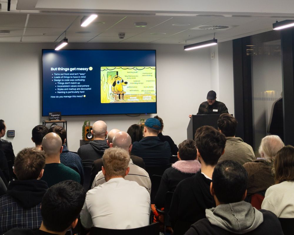 Sergio presenting in front of the audience. "Things get messy" on the slide
