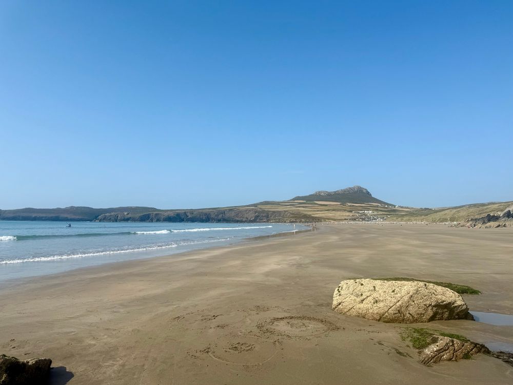 View along whitesands beach from the south. The peak of Carn Llidi is in the background. 