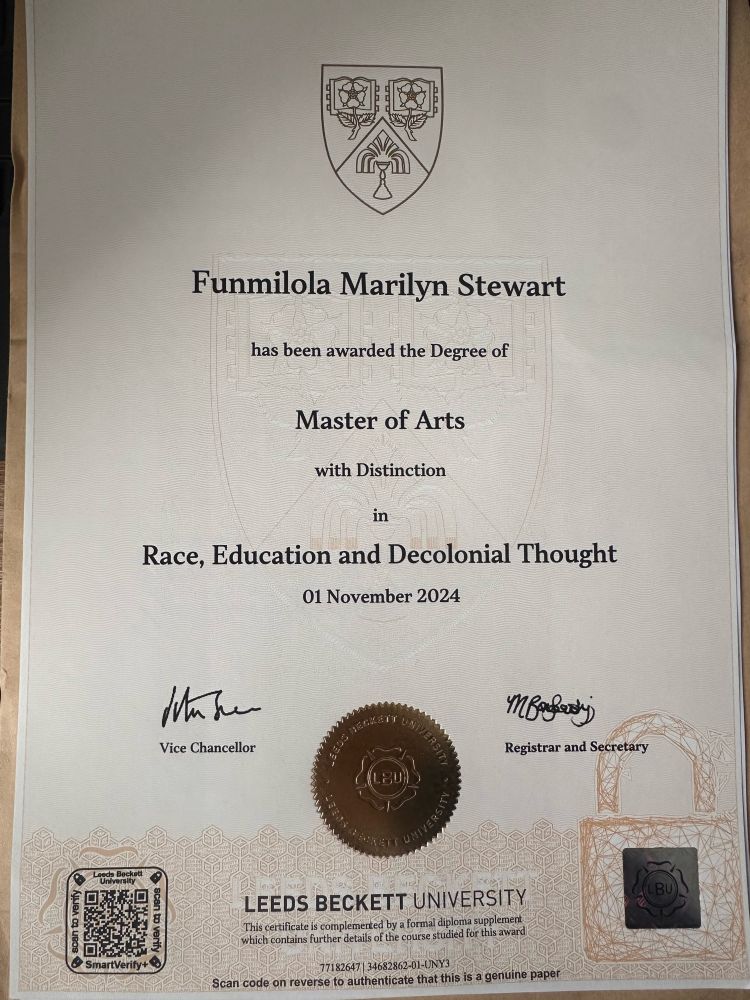 A photograph of a degree certificate awarded for the completion of the MA Race, Education and Decolonial Thought from Leeds Beckett University. 