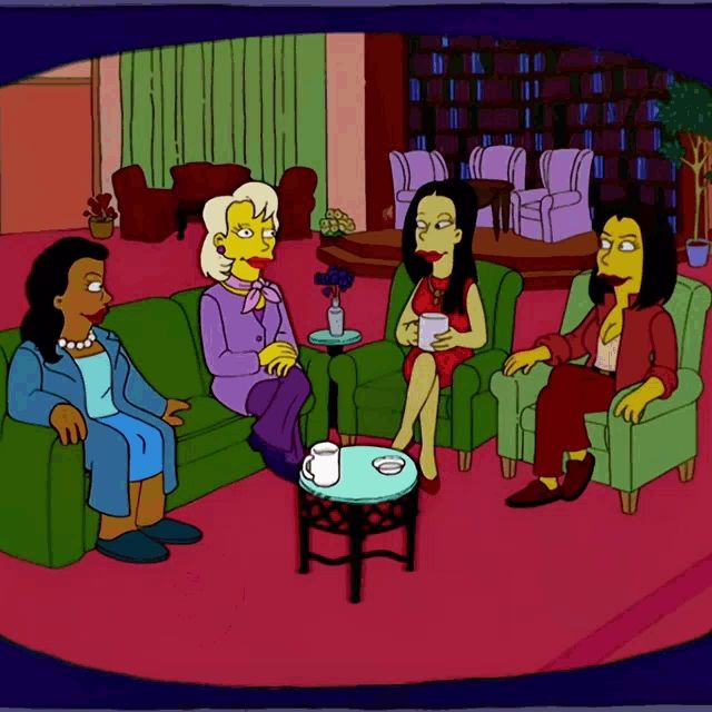 Simpsons gif: 4 women sitting in a talk show similar to the view with one saying "men" and the audience of women booing