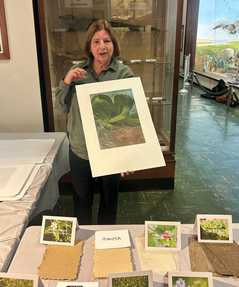 LSU College of Art and Design Professor Leslie Koptcho with a print she made of water lettuce, an invasive species in Louisiana 