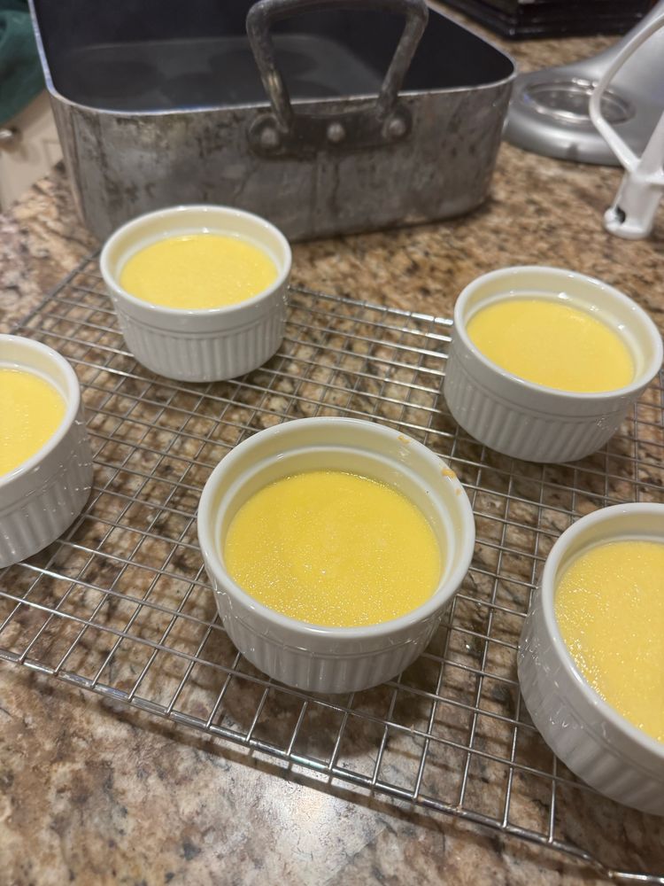 5 ramekins filled with creme brulee 