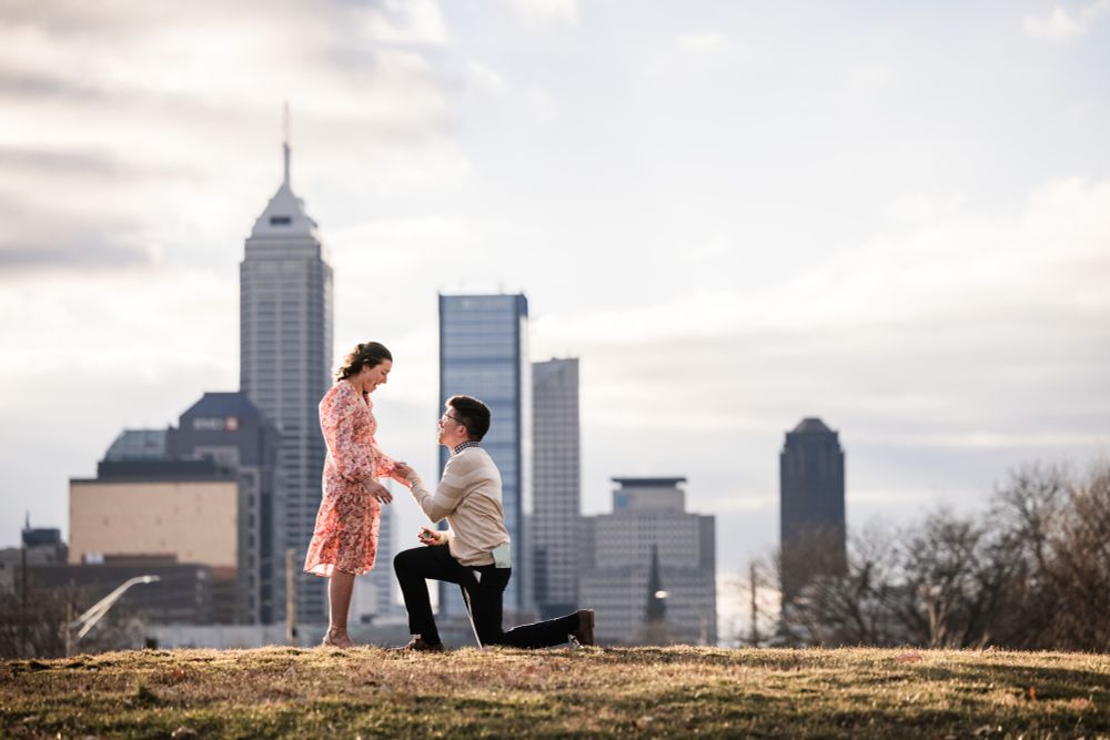 A proposal with the skyline of Indianapolis in the background 