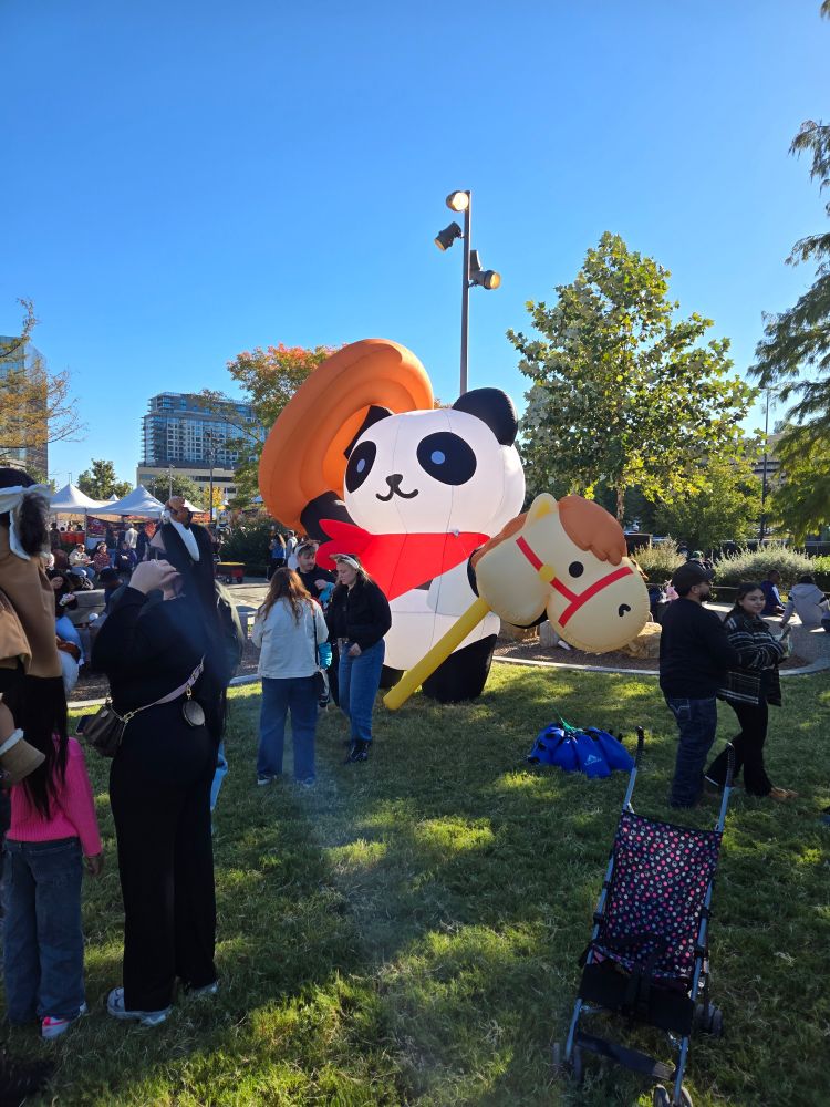 Giant inflatable cowboy panda