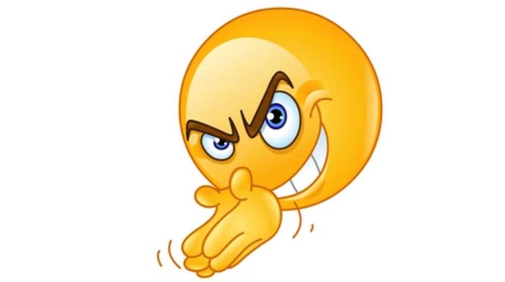 A yellow emoji that's rubbing its hands together mischievously 