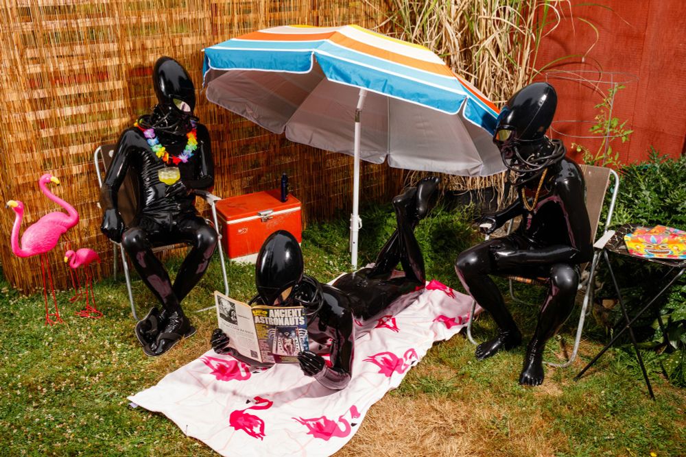 Three rubber aliens are enjoying some leisure time in the sun.