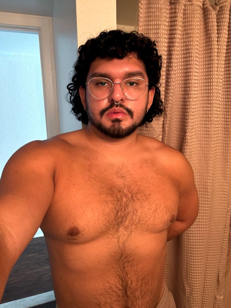 Shirtless selfie with warm lighting. 