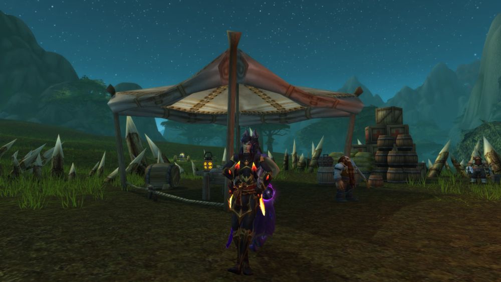 Twin dracthyr sisters, posing back-to-back, in Wetlands while leveling.