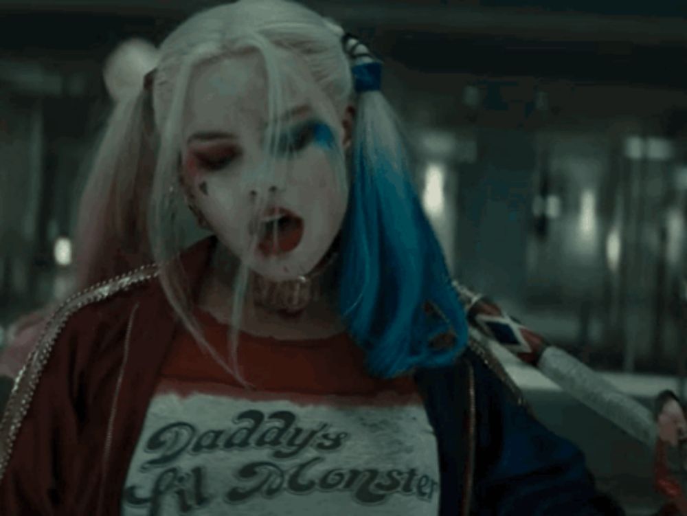 harley quinn is wearing a daddy 's monster t-shirt