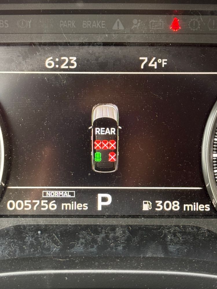 On the dashboard of a vehicle is a diagram of the seats inside, showing that the front driver’s side is the only one occupied. The problem is that the diagram also shows the hood of the SUV behind all of the seats. 