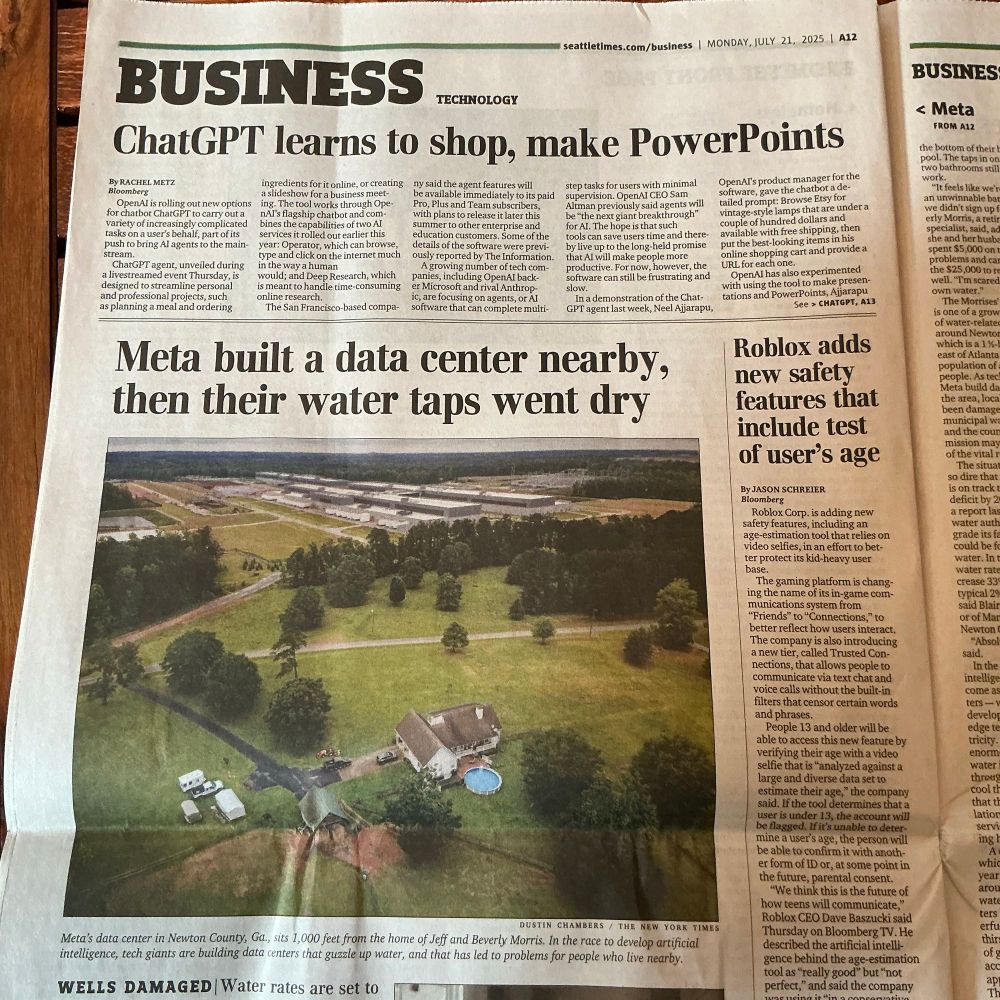 Image of July 21 Seattle Times, page A12. The top two headlines read “ChatGPT learns to shop, make PowerPoints” and “Meta built a data center nearby, then their water taps went dry.” The second article is illustrated with an aerial photo of a farm set in acres of grass and forest, with a new, huge data center complex looming nearby. 
