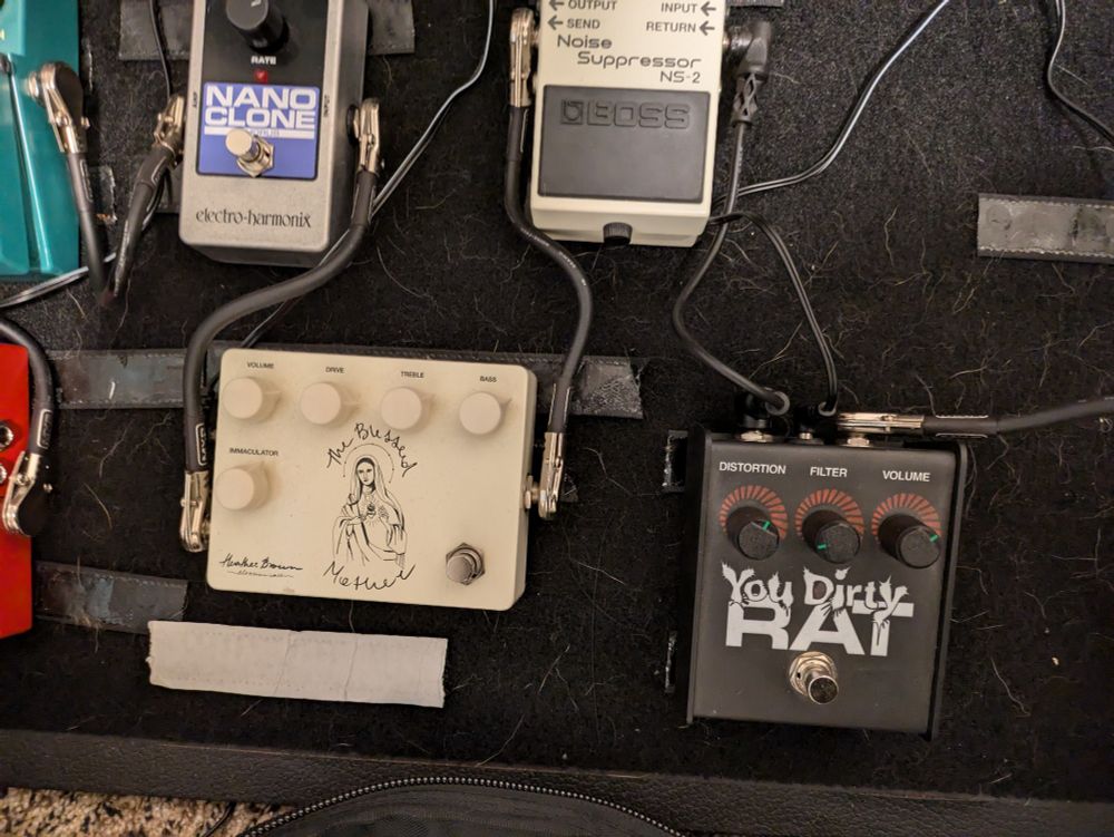 Guitar pedal board with a Blessed Mother, Nano Clone, noise suppressor, and Dirty Rat distortion 