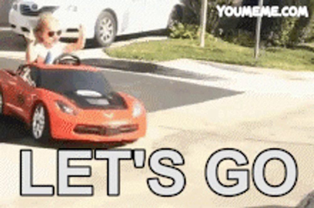 a picture of a child driving a red car with the words let 's go