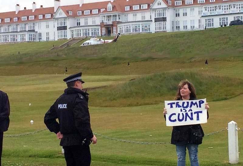 The late Janey Godley outside a Trump golf course with her infamous Trump sign