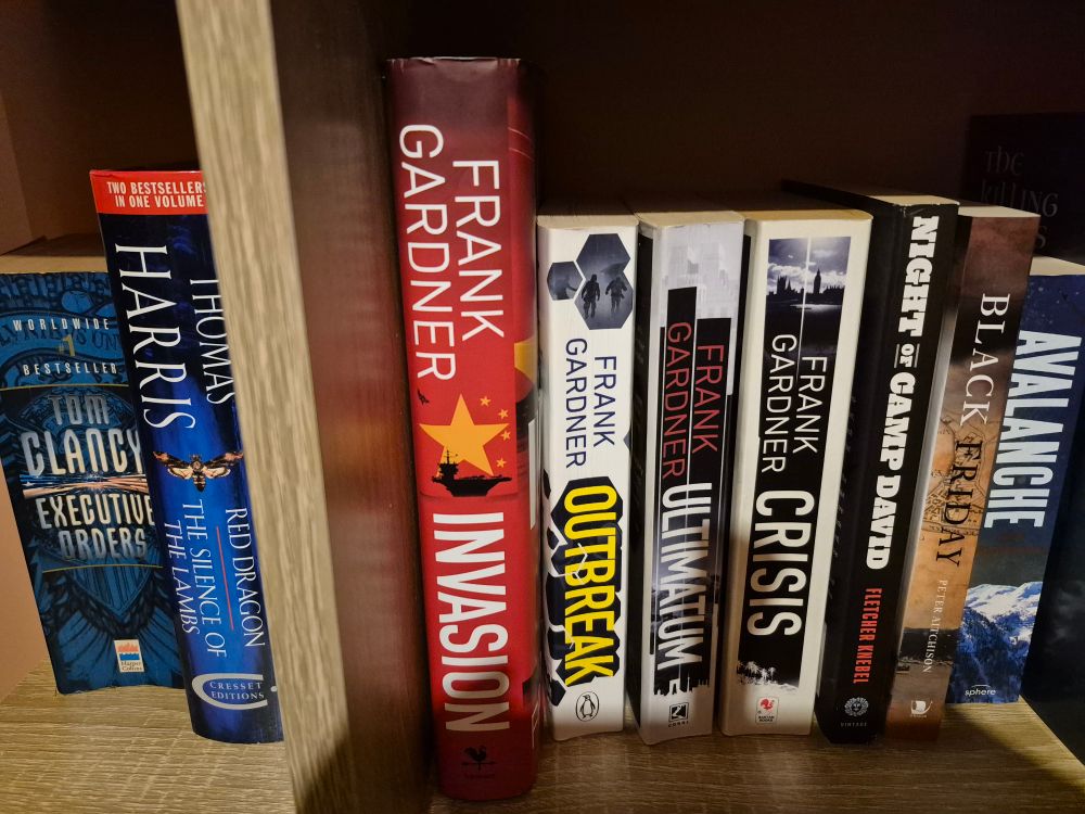Four books by Frank Gardner on my bookshelf. Crisis, the first, Ultimatum, the second, Outbreak the third, and the most recent hardback of Invasion. The order runs right to left. Because I didn't want a taller hardback in the middle of the shelf upsetting the line height. Because I'm a sad git...