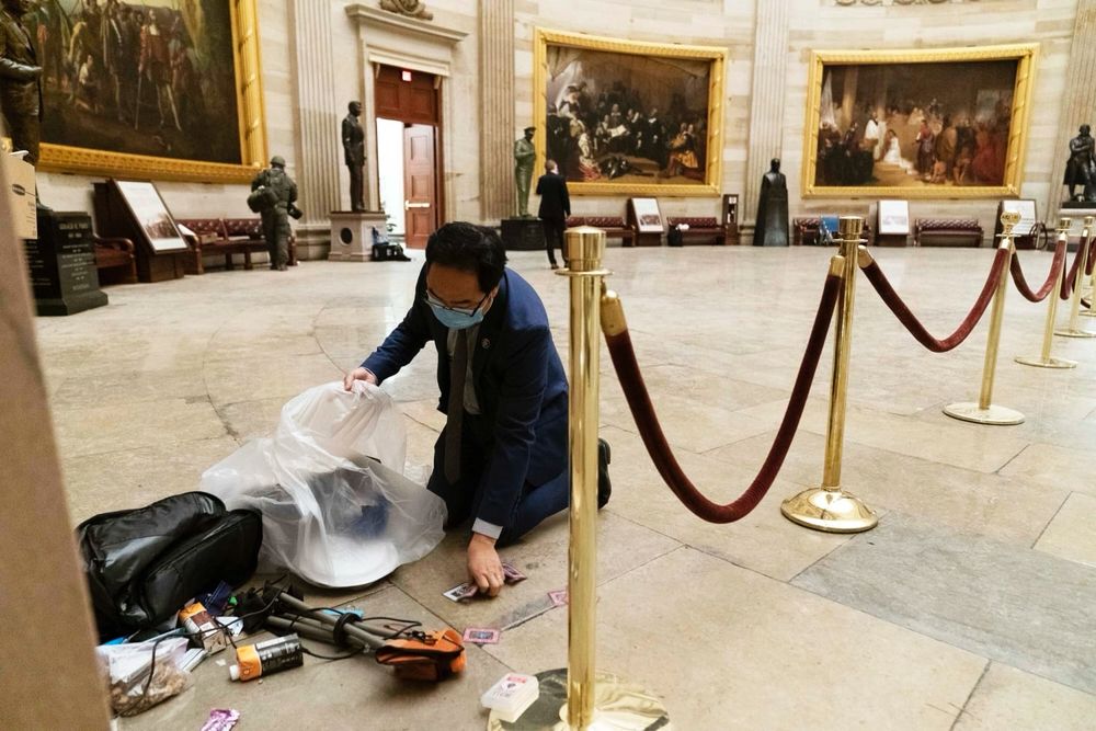 Future Senator Andy Kim cleaning up the rotunda on January 6