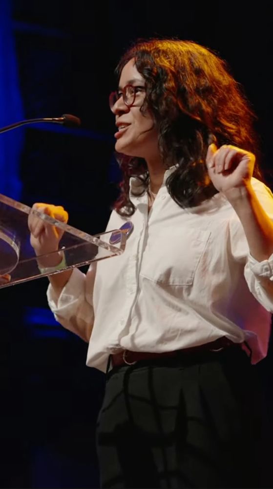 Photo of Claire Valdez, NYS Assembly Member for the 37th Assembly District and member of NYC-DSA's Socialists in Office, speaks at the rally for Zohran Mamdani tonight.
