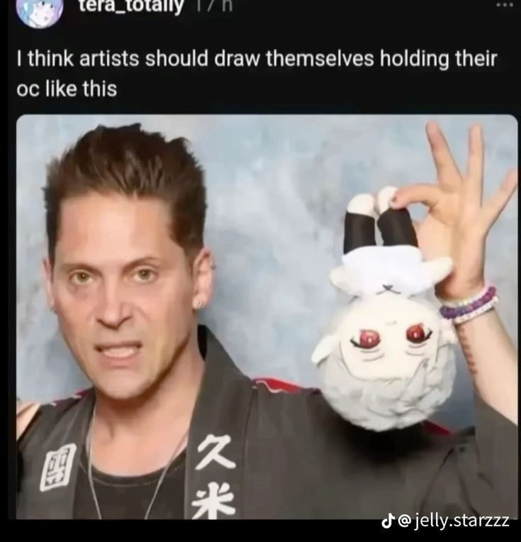 Source material, Niel newbon holding an Astarion plushie upside down with a grimace on his face
