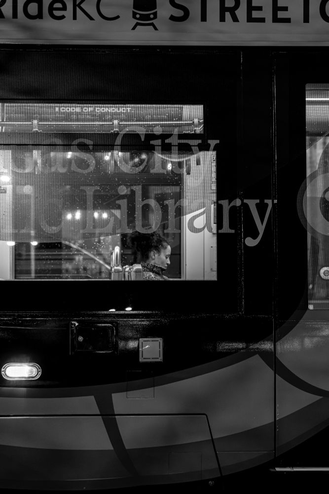 Lady on a KC streetcar, in b+w.