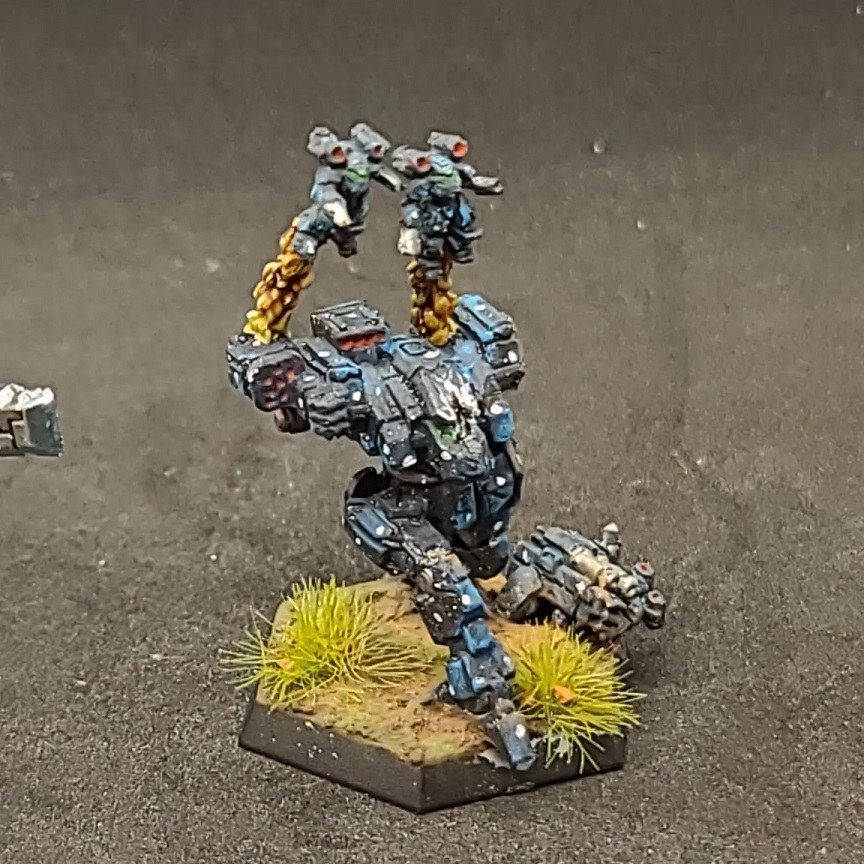 Ron "Tsula" Baker #925's Clan Ghost Bear Fire Moth took a hit, and unlike most, it is still going! The Elementals leaping off of the 'Mech is a fantastic touch! - https://www.threads.com/@tsula_paintbay