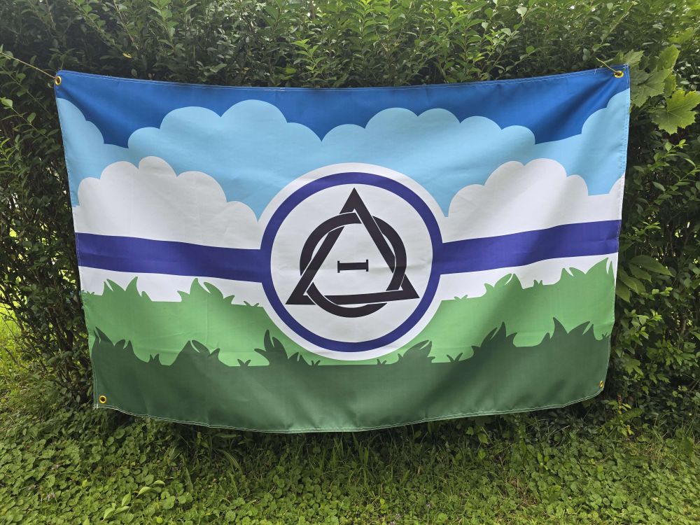 the same flag now propped up on some bushes to show off the design