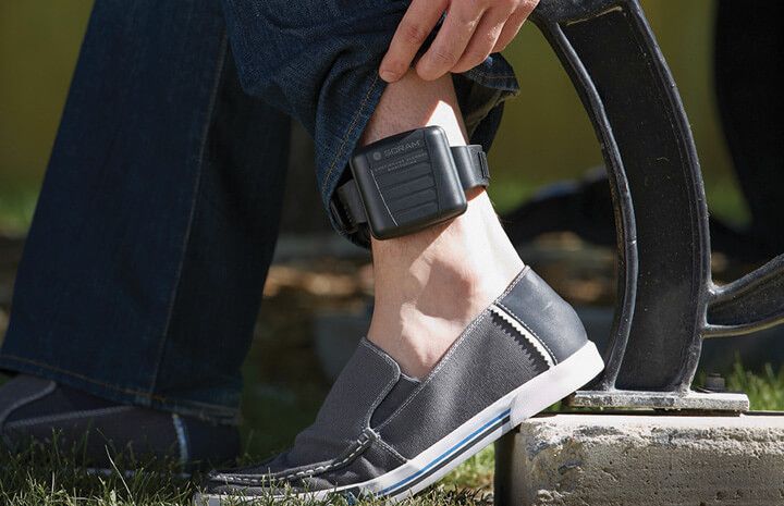 An ankle monitor.

If he'd said "AI enabled Ankle Monitor" it would only be half as stupid.