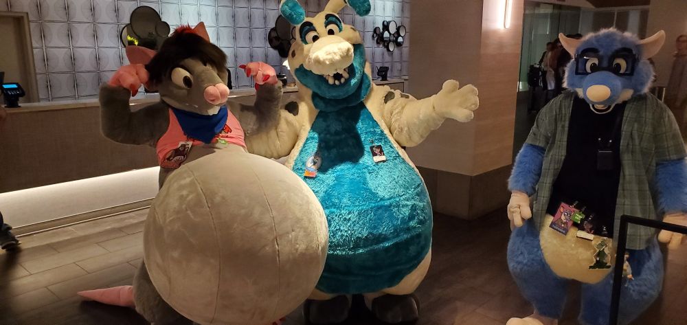 Three big bellied fursuits from left to right: a rat, Keel (space gator) and Byte (rat with glasses)