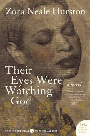 A book cover for "Their Eyes Were Watching God" by Zora Neale Hurston. The cover features a sepia-toned close-up image of a Black woman's face with closed eyes and serene expression. The image is textured.