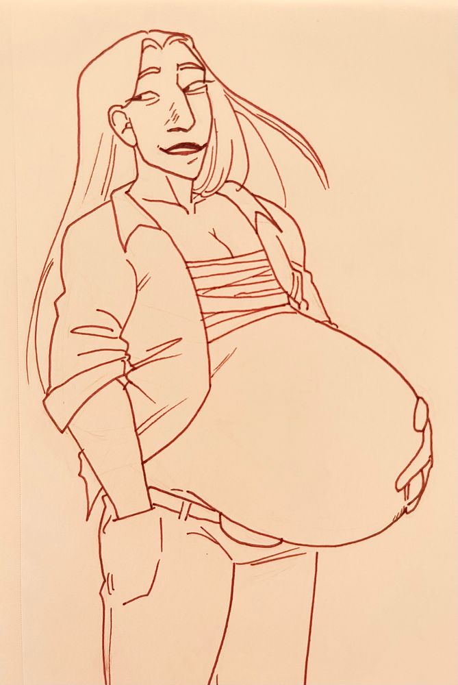 A man in an open button up and slacks is standing, his long hair flowing behind him.  His belly is swollen - he is pregnant with twins.  His left hand rests on his belly, while his right hand is in his pocket.