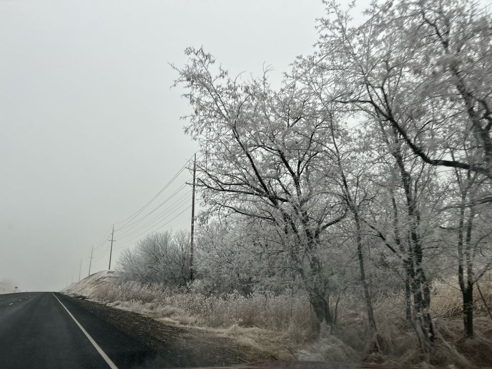 A frosty highway, sky, and the scenery near it