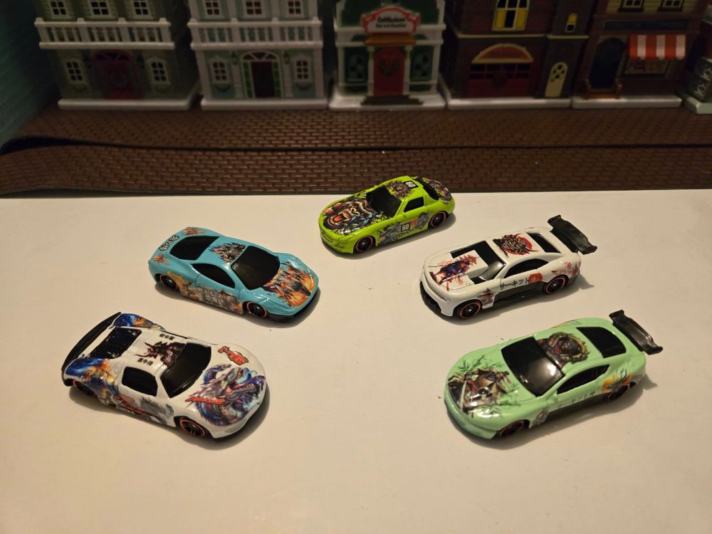 1. Porsche 918 Spyder.
2. Blue Ferrari F8.
3. Green Mercedes Benz SLS AMG.
4. White Chevy Camaro.
5. Green Aston Martin Vanquish.