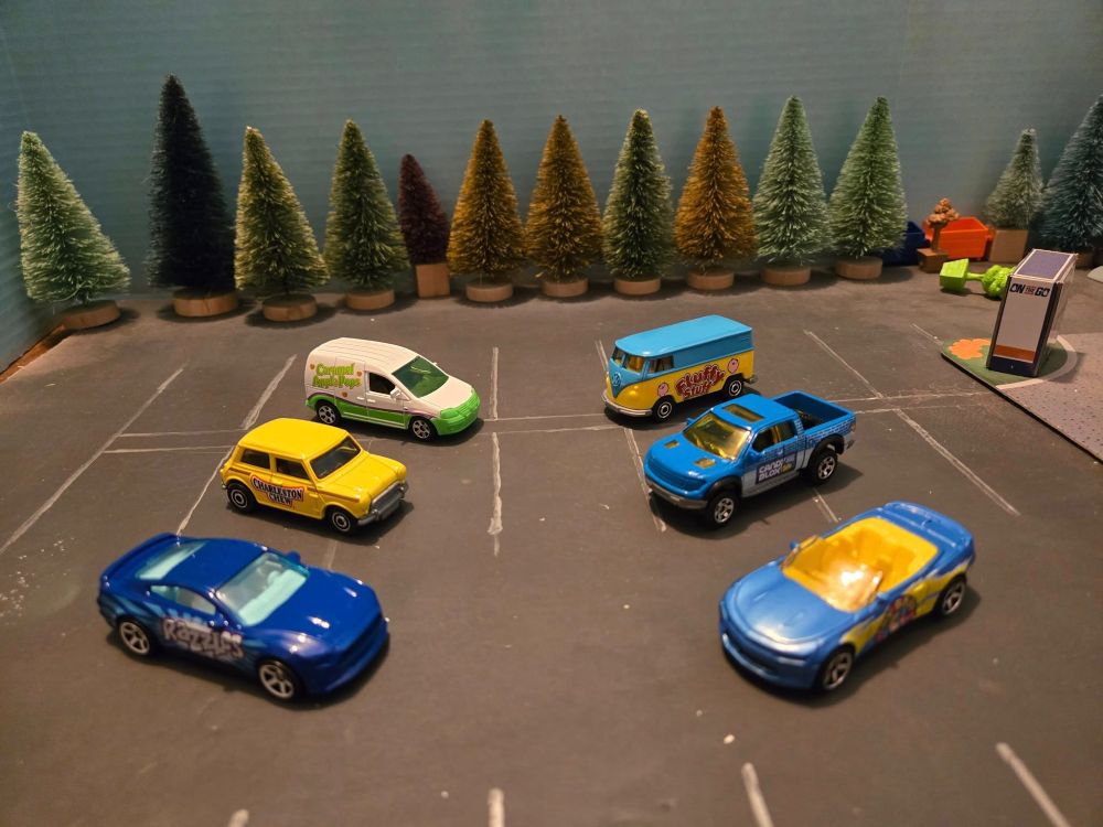 1. Caramel Apple Volkswagen Caddy Delivery.
2. Charleston Chew 1964 Austin Mini Cooper.
3. Razzles 2019 Mustang Coupe. 
4. Fluffy Stuff Volkswagen Delivery Van. 
5. Cry Baby Extra Sour Candy 2016 Chevy Camero Convertible.
6. Candy Blox 2010 Ford F-150 SVT Raptor.