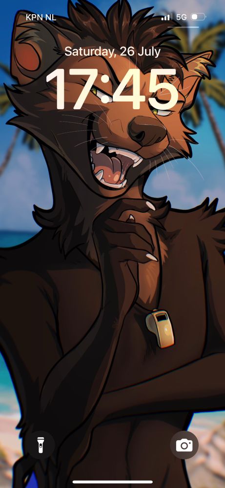 Anthropomorphic sable marten shown from the waist up, apparently posing for the camera on a beach, with a brass artillery whistle on a cord around his neck.