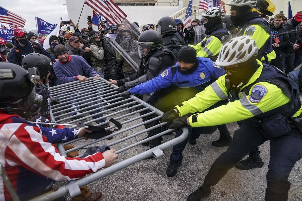 Republican thugs fighting with Capitol police to breach the barriers. 