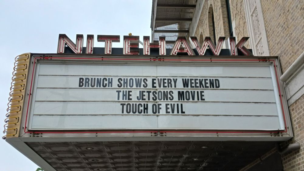 Theater marquee displaying brunch screenings of Jetsons: The Movie and Touch of Evil.