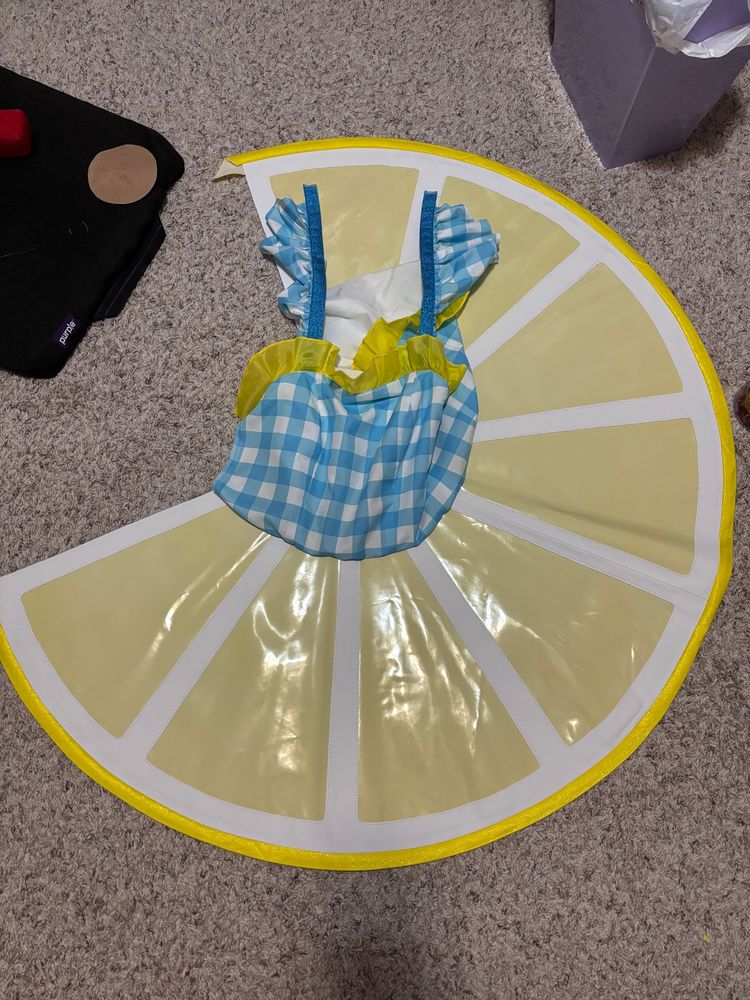 skirt and bodice attached and laid on floor

comments:
i just like this pic cause it reminds me of a tutu lol 

also installing the zipper on this thing was terrible, i miscalculated how stiff the vinyl skirt would be to get in and out of and cut the zipper too short so it's going to be an eternally tight squeeze wahhhhh 