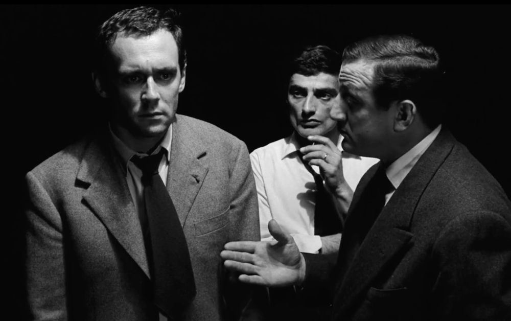three extremely front-lit men wearing shirts and ties in Elevator to the Gallows (1958)