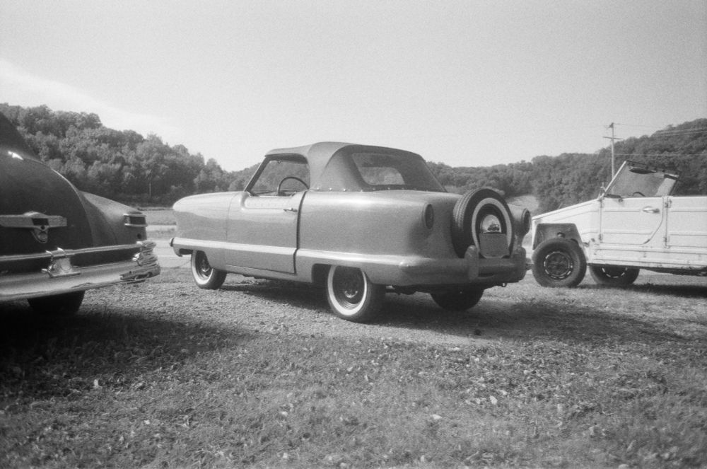 Nash Metropolitan alongside a road. 