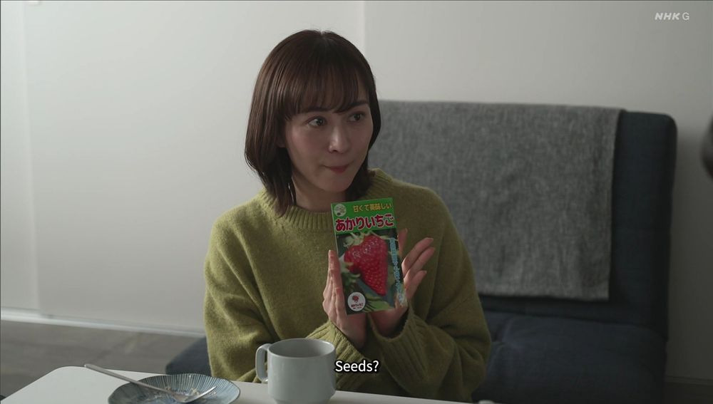 Nomoto holds up a packet of strawberry seeds.