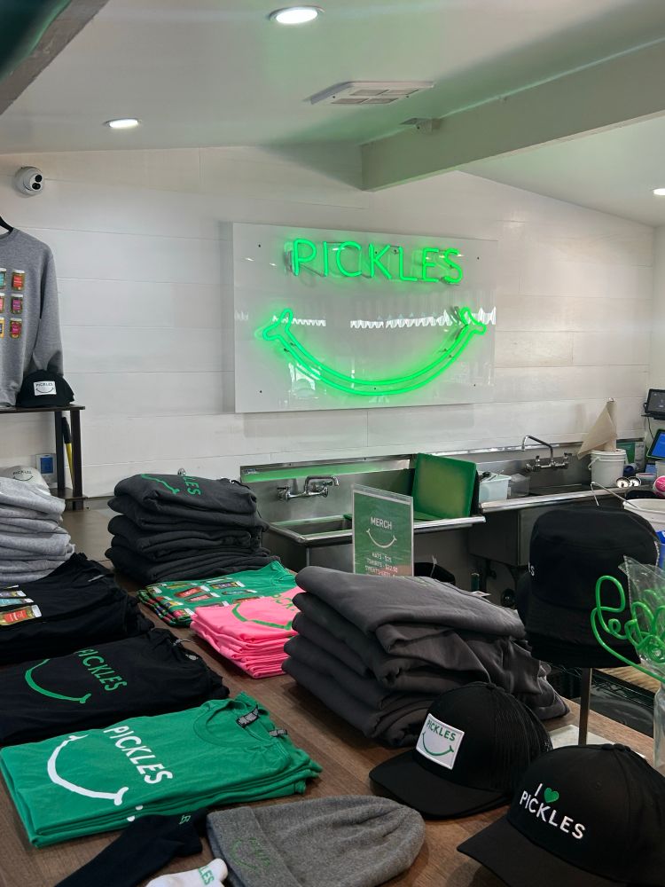 Pickles! Pickles! Pickles!

Pickle shirts, pickle hats, pickle beanies, and general pickle merch for Canadians to bring home with them. But BEWARE CANADIANS, because your border patrol security will likely confiscate all pickle goods to comply with the general ban on pickility in your country, and honestly you should know better by now.