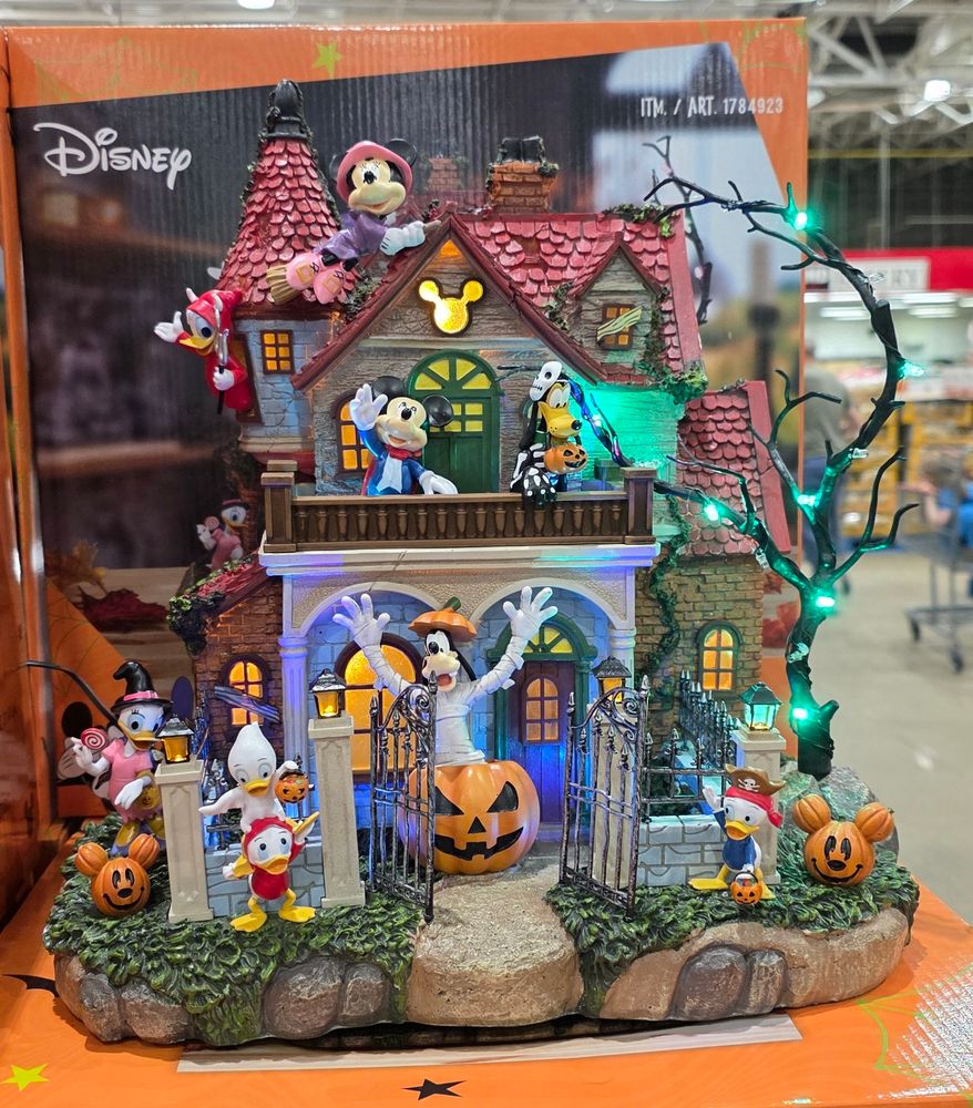 A model haunted house full of Disney characters. 