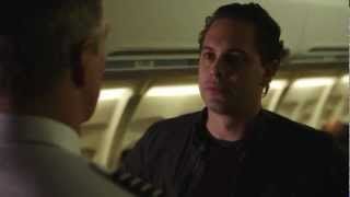 Scene from The Newsroom: a man with a serious expression speaks to a pilot