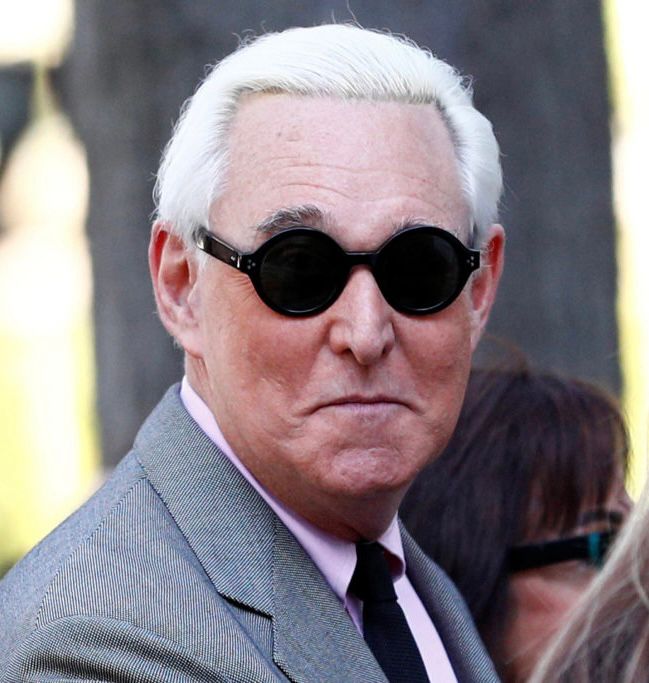 Noted swinger and cuckolding fetishist Roger Stone in some dumbass sunglasses with a dumbass look on his face 