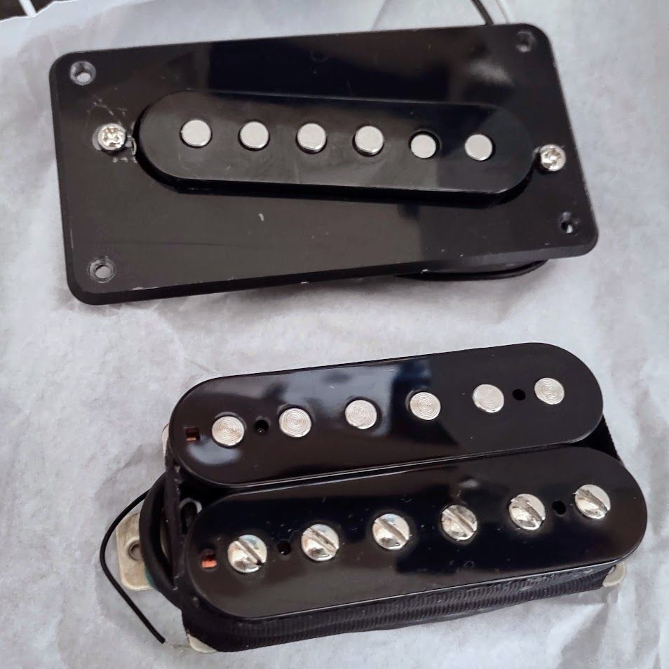 A cheap, Temu single-coil pickup and a PlanetTone Full Throttle humbucker, which might replace the Ibanex Powersound pickups in my cheap, Cort-made Indonesian Ibanez Gio GAX50 this weekend. The Temu pickup will be replaced soon with a PlanetTone Venus Isle, but that may be 30+ days away. It's on order, but these are built as they're ordered, in Colorado. I have little use for a neck humbucker, so... 